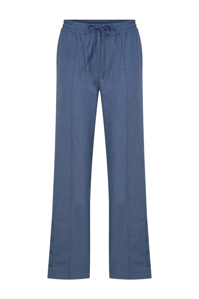 Blue ColoReve sweat pants with elastic waistband and relaxed fit, shown on a model. Comfortable casual pants for everyday wear.