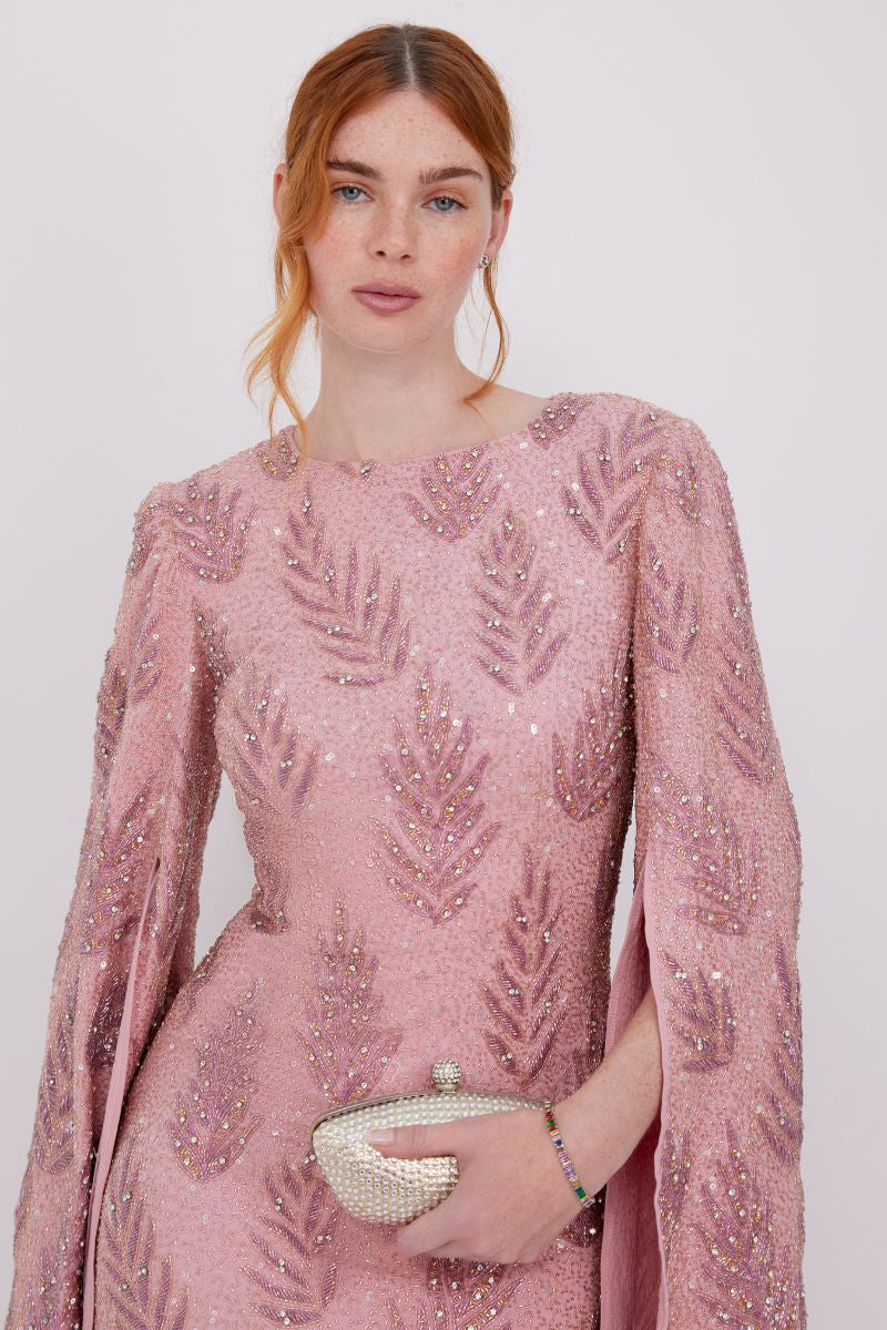 Raishma Cynthia gown featuring elegant fabric and detailed design, showcased on a model in a formal setting.