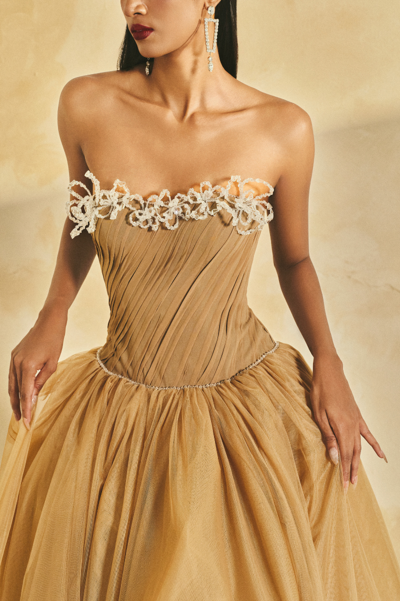 Elegant off-shoulder chiffon and mesh gown by L'SCARLETT featuring flowing fabric and intricate design.