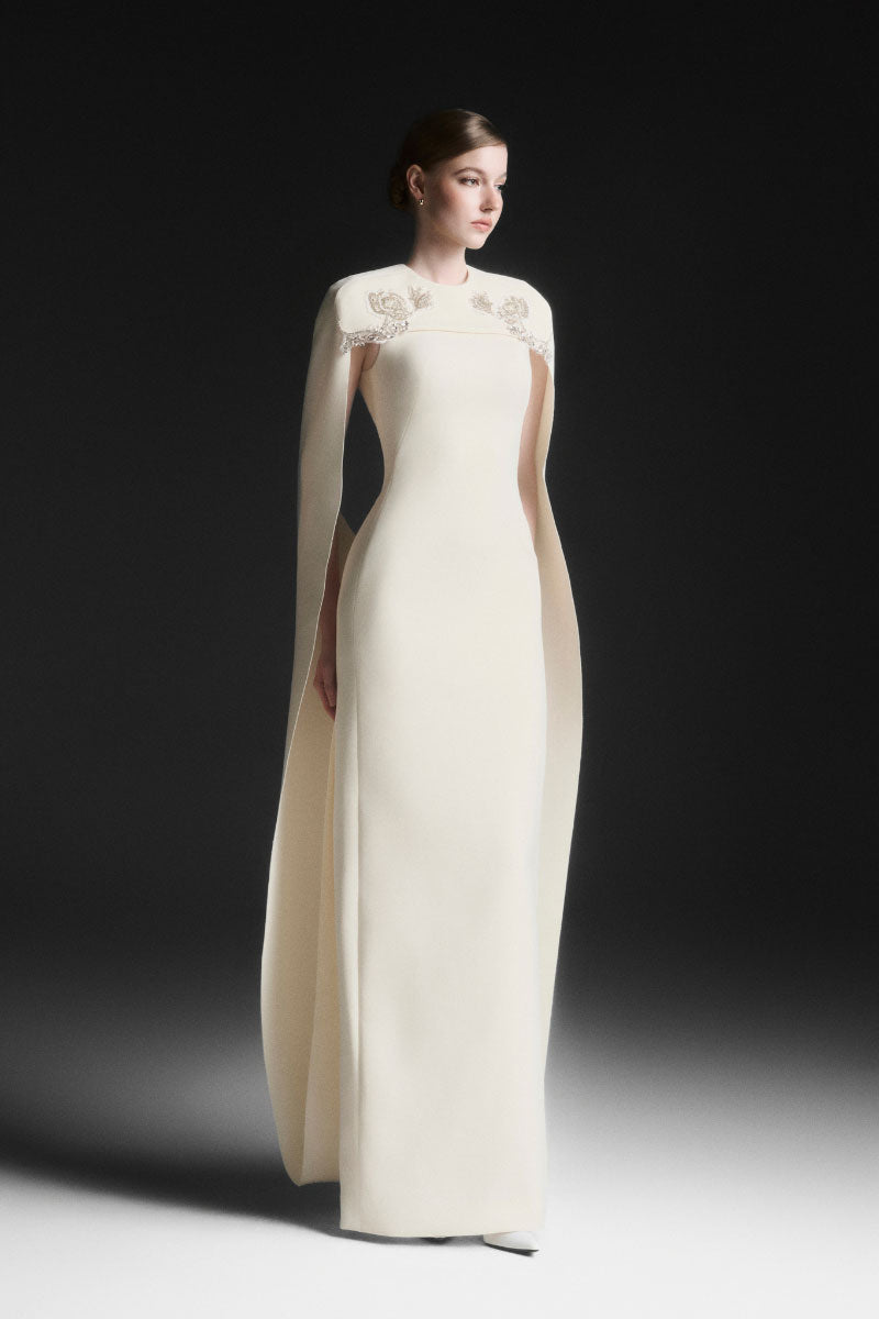Maison Des Copains NYXELLE cape sleeve floor-length vanilla cream maxi dress displayed on a model.