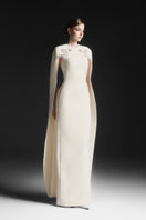Maison Des Copains NYXELLE cape sleeve floor-length gown in vanilla cream, elegant evening dress with flowing fabric and cape sleeves.