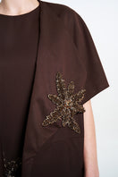 Aidan & Ice NAIRA OUTER in brown, stylish coat with a fitted silhouette, displayed on a hanger against a neutral background.