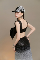 Arti Apparel Shannon midi skirt in flowy fabric with a high waist and pleated design, perfect for stylish everyday wear.