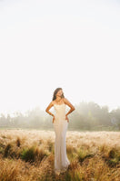 Elegant ivory pearl corset gown by Deme By Gabriella featuring intricate beadwork and a fitted silhouette.