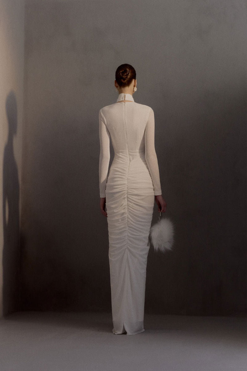 White Plan Armetis gown featuring elegant fabric and intricate design, perfect for formal occasions.