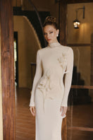 Elegant DOHA gown by Arti Apparel featuring intricate embroidery and flowing fabric, perfect for formal occasions.