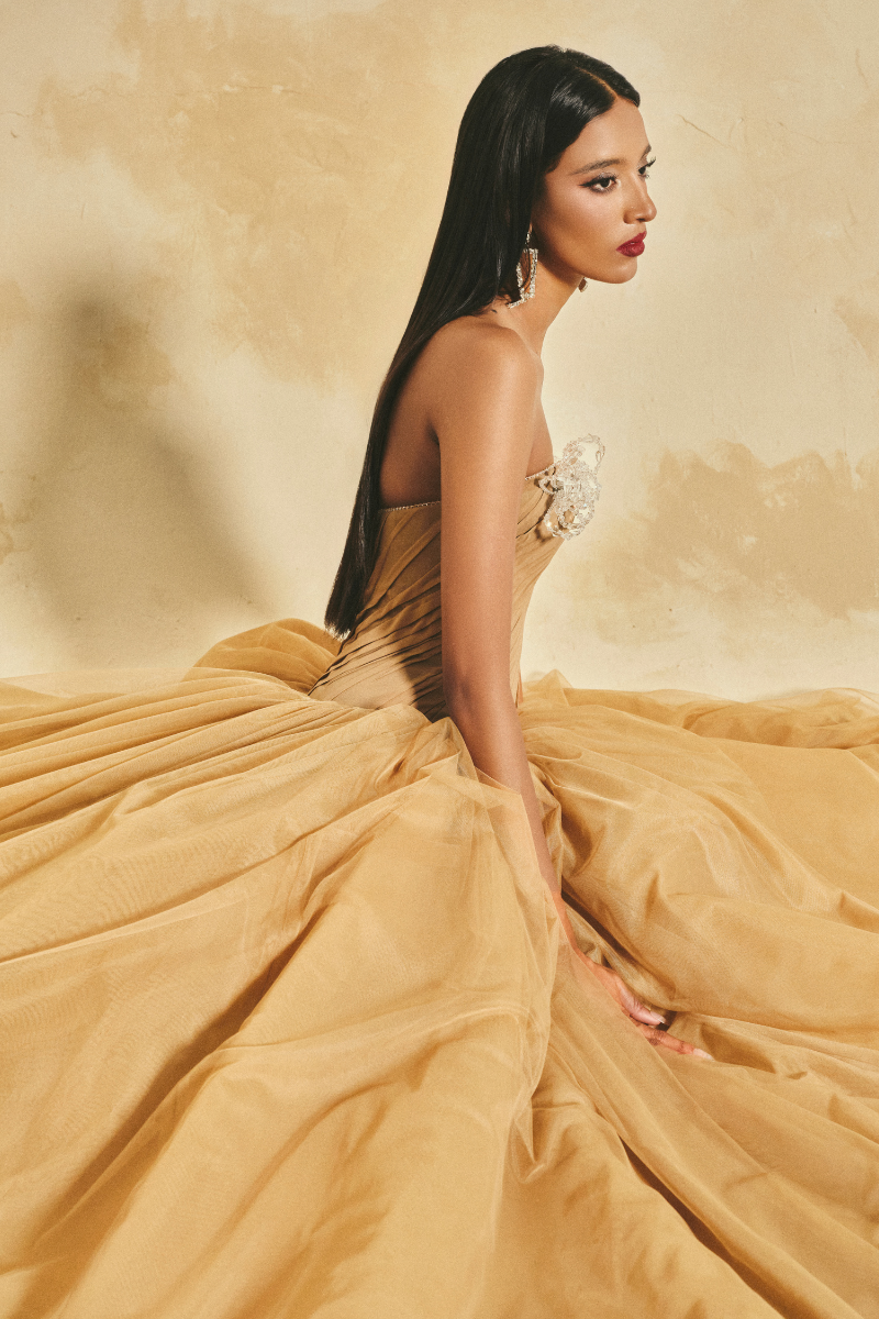 L'SCARLETT off-shoulder chiffon and mesh gown with flowing fabric and elegant design for formal occasions.
