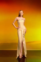 Elegant CEM satin crystal gown with intricate beadwork and flowing fabric, showcased on a mannequin.
