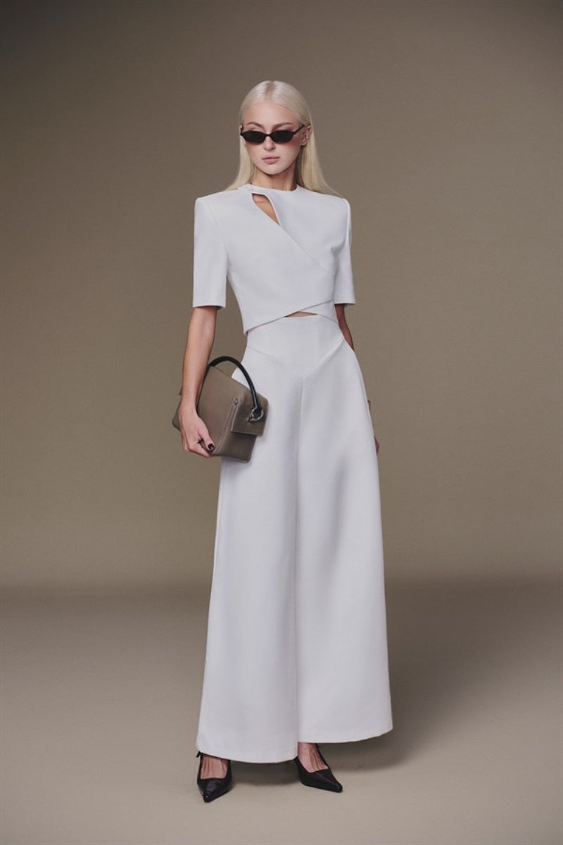 White diagonal pants by Keira Tong featuring a stylish fit and diagonal seam details, designed for a modern, casual look.