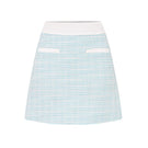Valenciani mint tweed mini skirt shown with a fitted waist and classic checkered pattern, perfect for stylish casual wear.