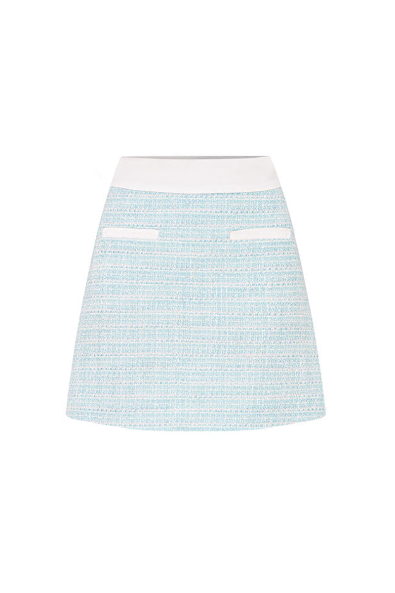Valenciani mint tweed mini skirt shown with a fitted waist and classic checkered pattern, perfect for stylish casual wear.