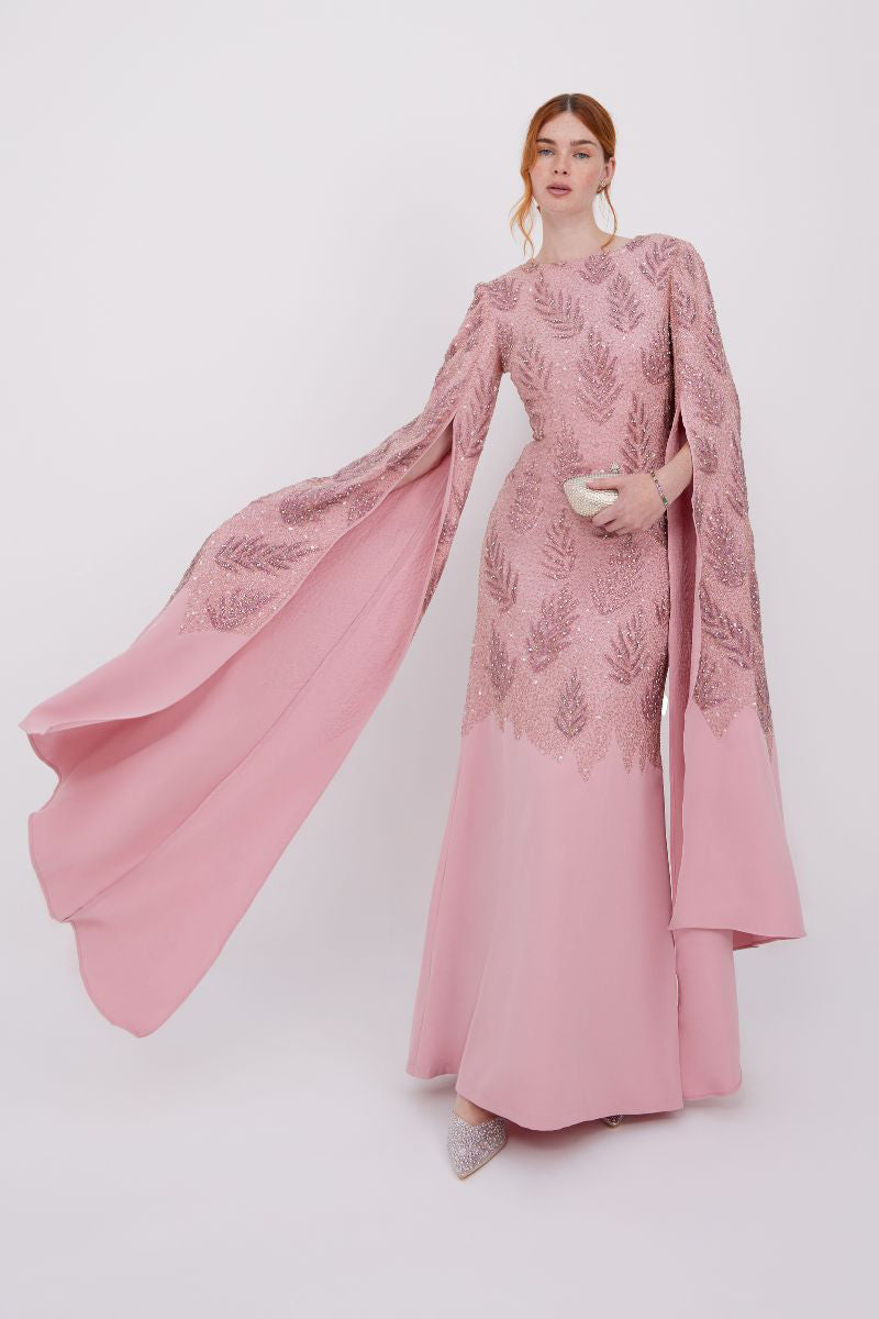 Elegant Raishma Cynthia gown with intricate lace detailing and flowing fabric, displayed on a mannequin.