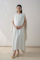 White off-shoulder maxi dress by DOC BAN, flowing fabric, and elegant design perfect for summer or special occasions.