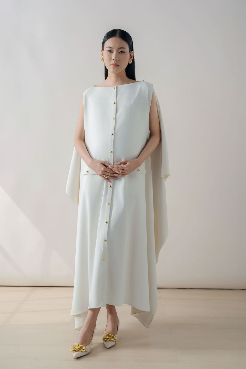 White off-shoulder maxi dress by DOC BAN, flowing fabric, and elegant design perfect for summer or special occasions.