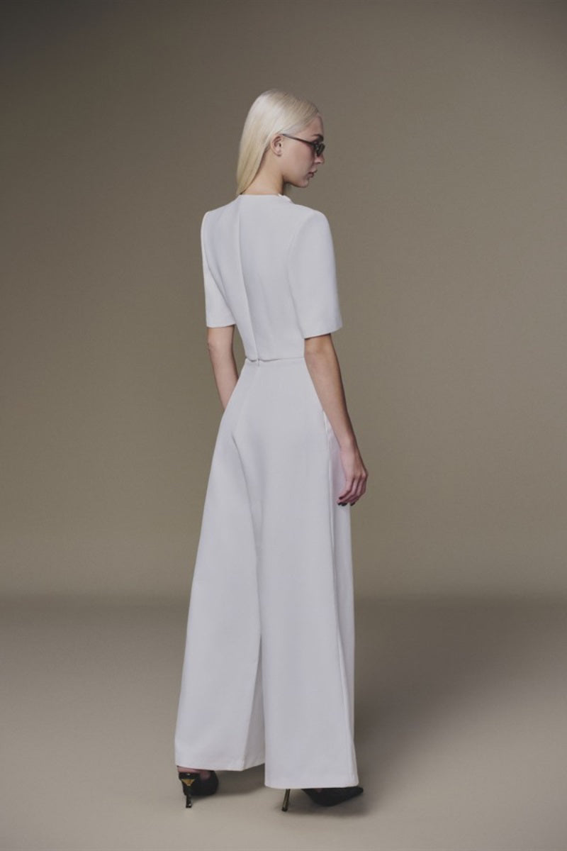 Keira Tong white diagonal pants shown on a model, featuring a relaxed fit with diagonal seam details and a modern, stylish design.