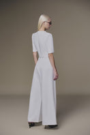 White diagonal pants by Keira Tong featuring a relaxed fit and stylish diagonal seam details.