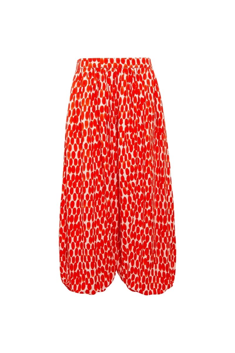 Sisters Ines Pants in Ruby Rush, stylish women's pants with a vibrant red hue, displayed on a model.