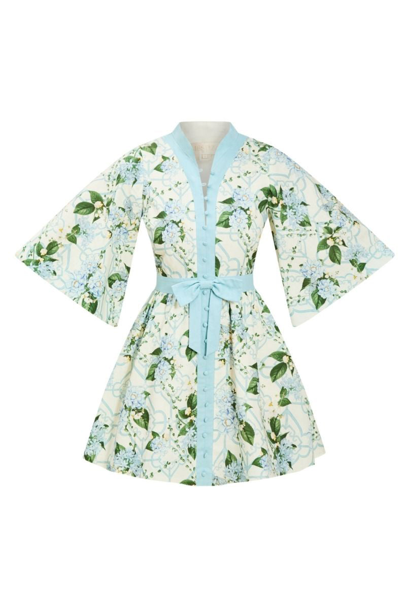 Mestiza New York Carmen mini dress in Quatrefoil Garden print, featuring a fitted silhouette and vibrant floral pattern.