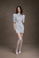 Keira Tong lace patch mini dress showing intricate lace details and fitted silhouette on model.