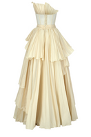 Elegant Claire vanilla tiered gown by Tarık Ediz featuring flowing fabric and layered design, perfect for formal occasions.