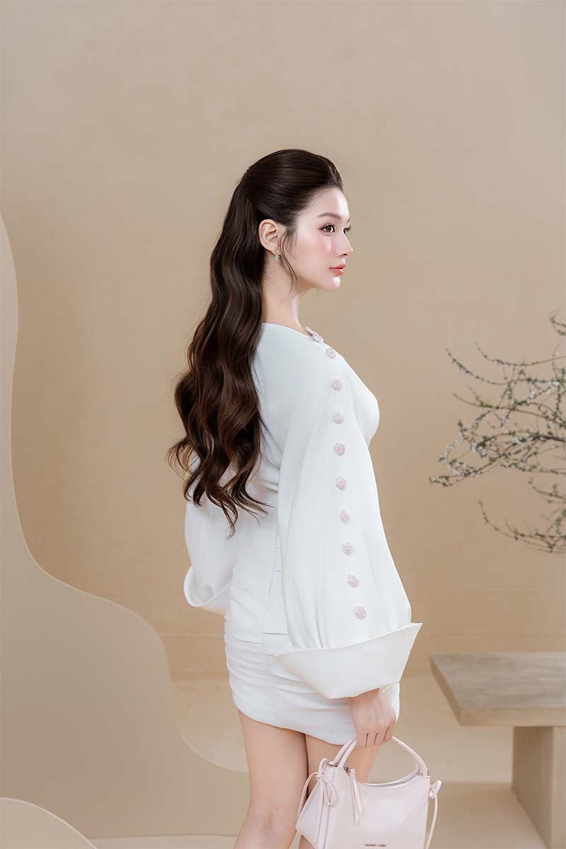 Do Long Celestial Veil Mini Dress displayed on a model, featuring a stylish, flowing design ideal for fashionable occasions.