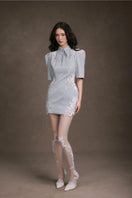 Keira Tong lace patch mini dress featuring intricate lace details and a fitted silhouette, perfect for stylish occasions.