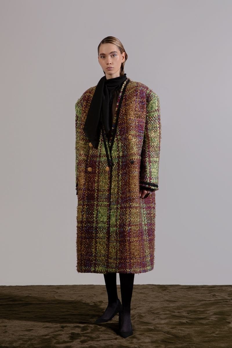 Lalo oversized brown tweed coat with wide lapels and long sleeves, displayed on a hanger against a neutral background.