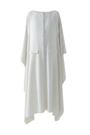 White off-shoulder maxi dress by DOC BAN, flowing fabric, and elegant style perfect for summer or formal occasions.