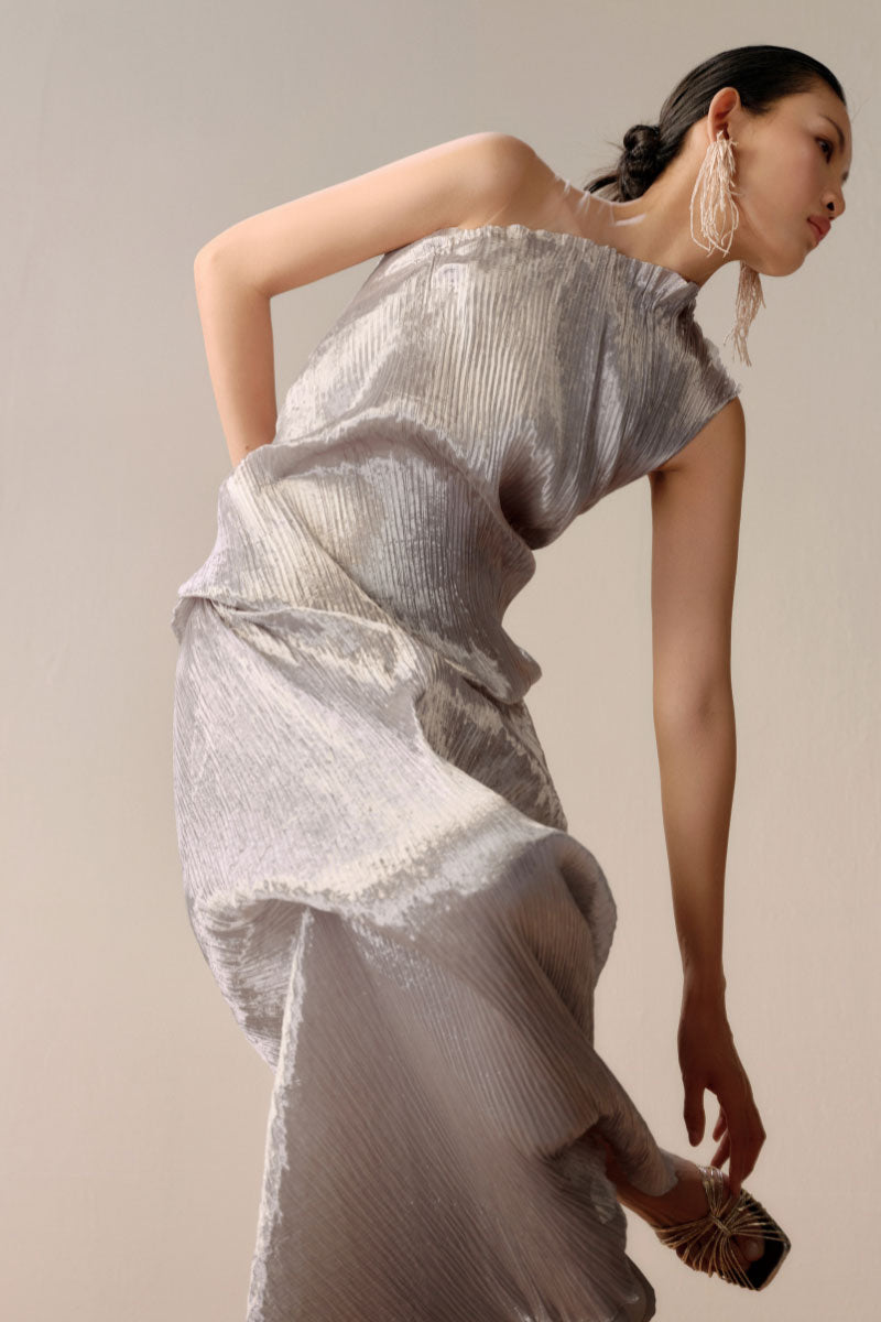 Silver Sand gown by LeCia, elegant silver maxi dress with flowing fabric and subtle shimmer, perfect for formal occasions.