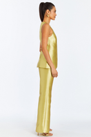 Mestiza New York Elena tailored top in golden green, featuring a fitted design and elegant neckline, styled on a model.