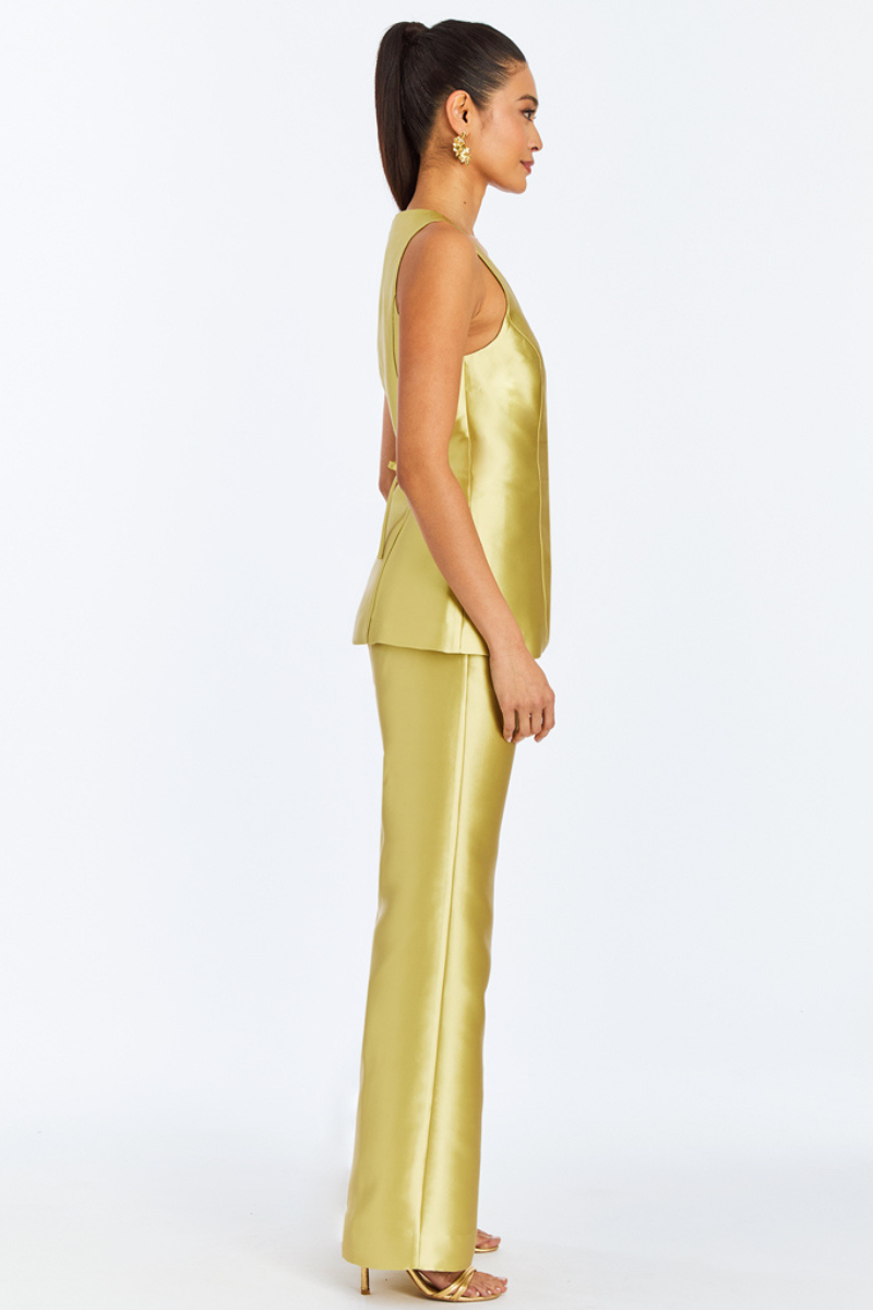Mestiza New York Elena tailored top in golden green, featuring a fitted design and elegant neckline, styled on a model.