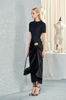 Black orchid patterned silk midi dress with waist-dipped design from Do Long, styled as a elegant midi dress.