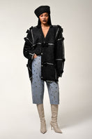 Lalo oversized cardigan with black and silver floral pattern, cozy knit with long sleeves and relaxed fit.