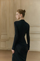 Margée Atelier MIA Maxi Dress in flowing fabric with floral pattern, sleeveless design, and elegant neckline.