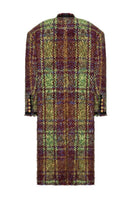 Lalo oversized brown tweed coat hanging on a wooden rack, showcasing the textured fabric and relaxed fit style.