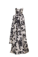 Black and ivory Daffodil gown by Tarık Ediz displayed on ghost mannequin, showcasing elegant back design and flowing fabric.