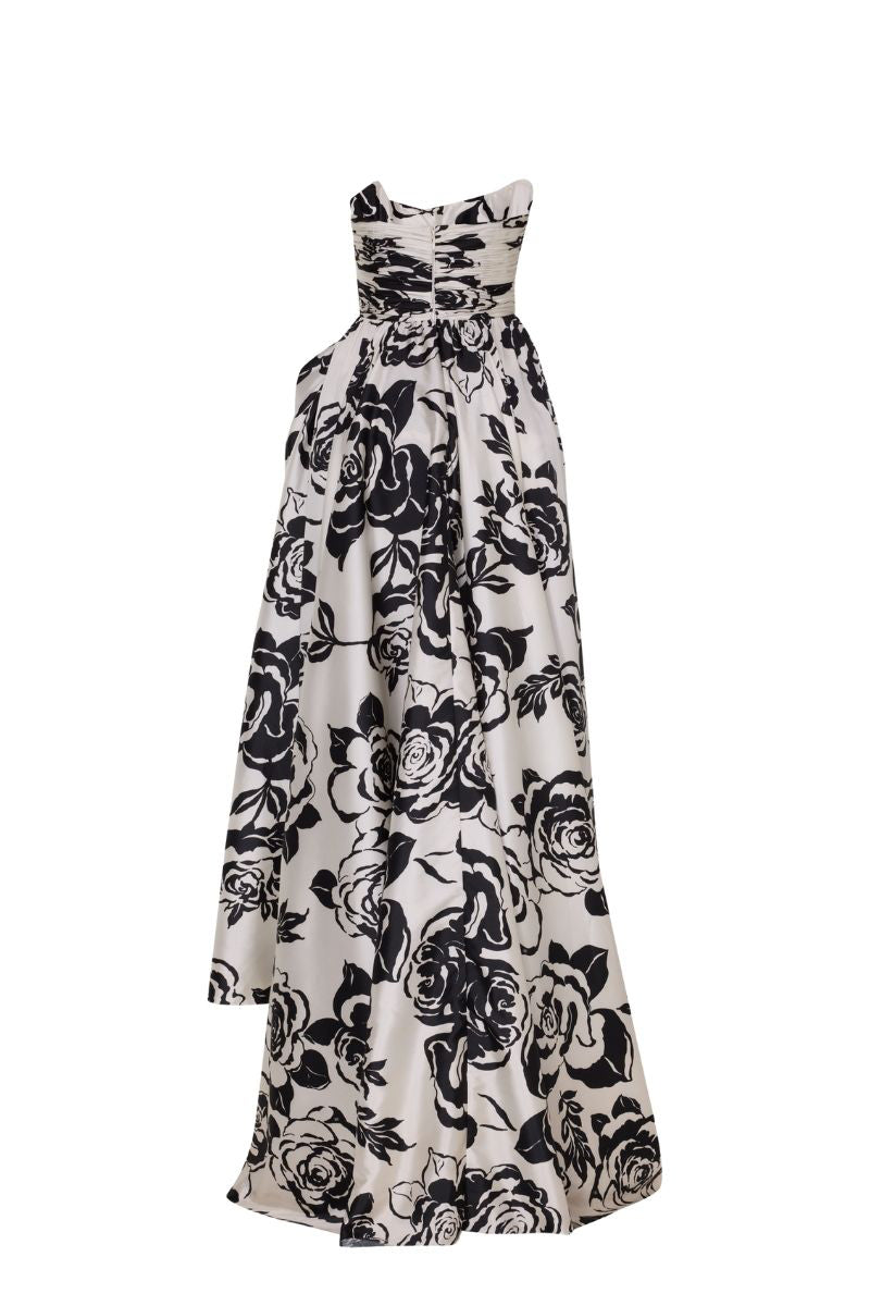 Black and ivory Daffodil gown by Tarık Ediz displayed on ghost mannequin, showcasing elegant back design and flowing fabric.