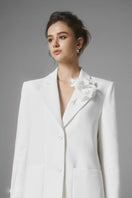 White Ontario mini skirt by Arti Apparel, shown on a model, with a fitted waist and stylish short hem.