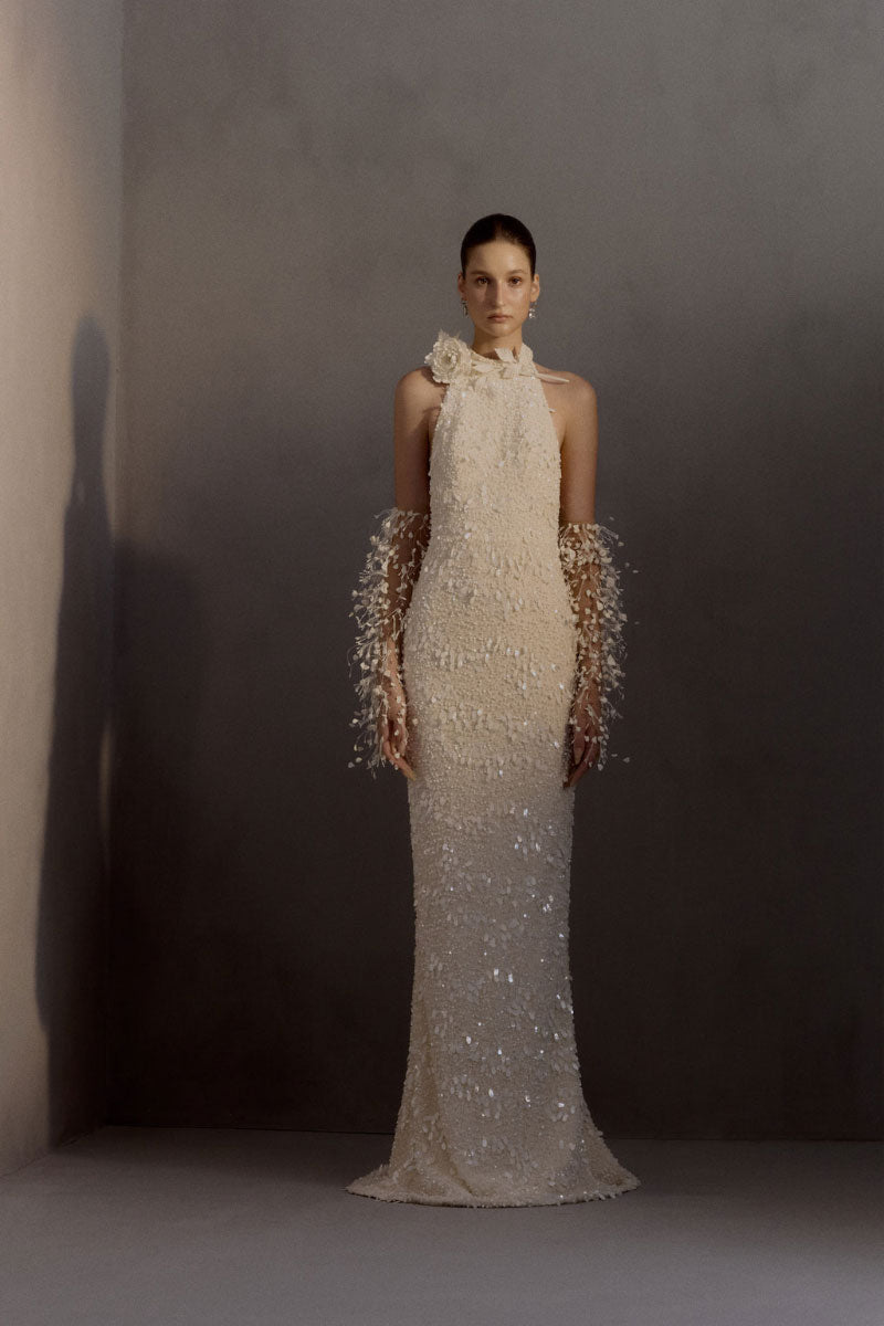Elegant white chiffon gown by White Plan featuring flowing fabric and a graceful design, perfect for formal occasions.
