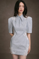 Keira Tong lace patch mini dress with intricate lace details and a fitted silhouette, perfect for stylish occasions.