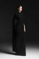 Black Maison Des Copains Celiora cape sleeve floor-length maxi dress with flowing fabric and elegant design.