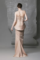 Golden beige peplum trumpet beaded gown by Phan Huy featuring intricate beadwork and a fitted silhouette.