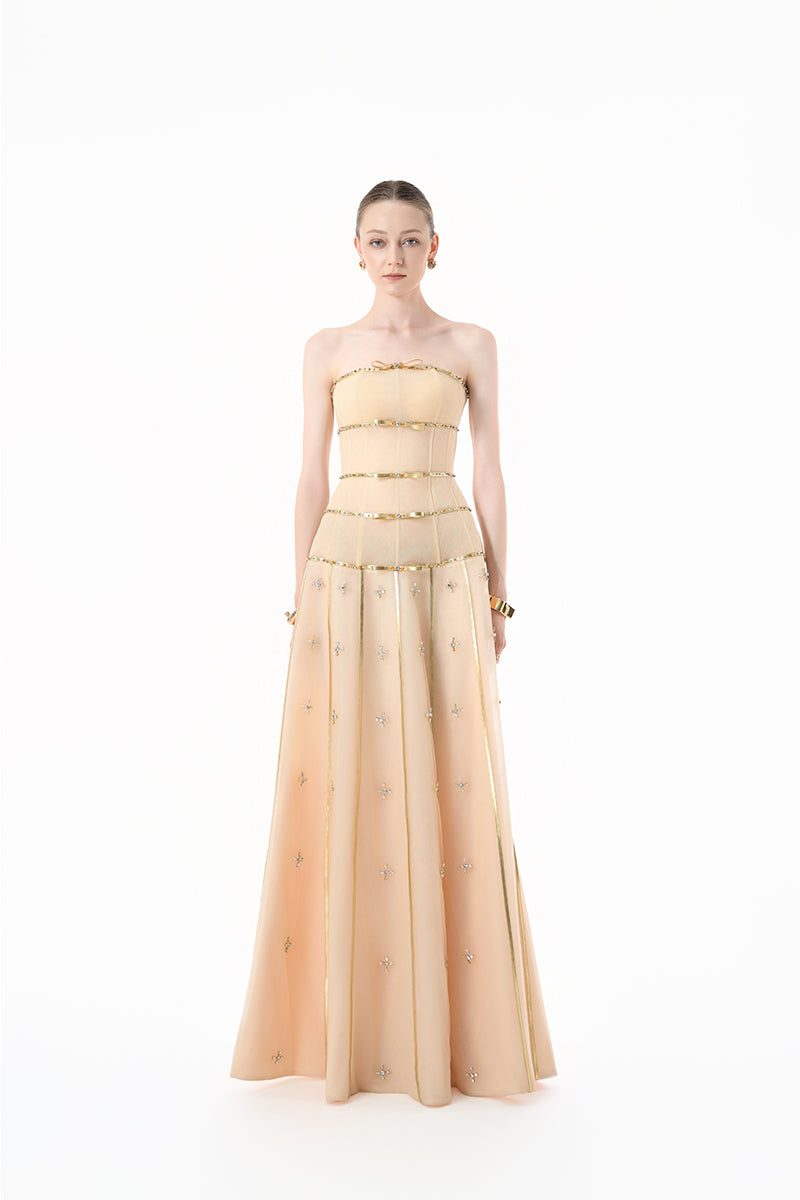Elegant nude gold-banded embellished A-line gown by Happy Clothing with intricate detailing and flowing fabric.