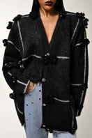 Lalo oversized cardigan with black and silver floral pattern, cozy knit fabric, and relaxed fit.