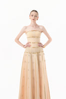 Nude gold-banded embellished A-line gown by Happy Clothing featuring intricate beadwork and flowing fabric.
