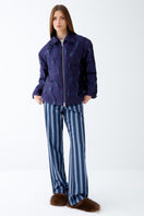 Purple textured puffer jacket by ColoReve, featuring quilted design and stand-up collar for warmth and style.