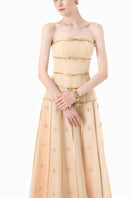 Elegant nude gold-banded embellished A-line gown by Happy Clothing, featuring intricate details and flowing fabric.