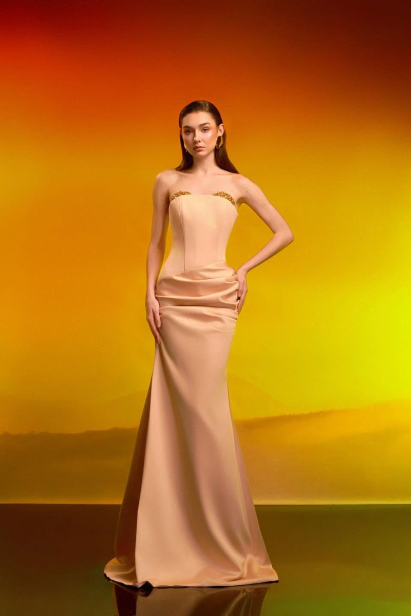 Elegant crystal bust gown by CEM featuring intricate beadwork and a flowing silhouette, perfect for formal occasions.