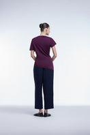 Asymmetrical short sleeve top by Dāl the Label, featuring a stylish, modern design with unique hemline and lightweight fabric.
