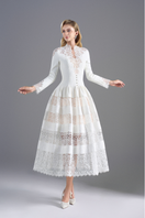White lace high-neck midi dress by ROSEE DE MATIN, featuring intricate lace details and a fitted silhouette.